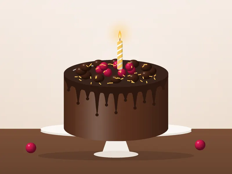Torta di compleanno al cioccolato con glassa lucida, lamponi e candeline